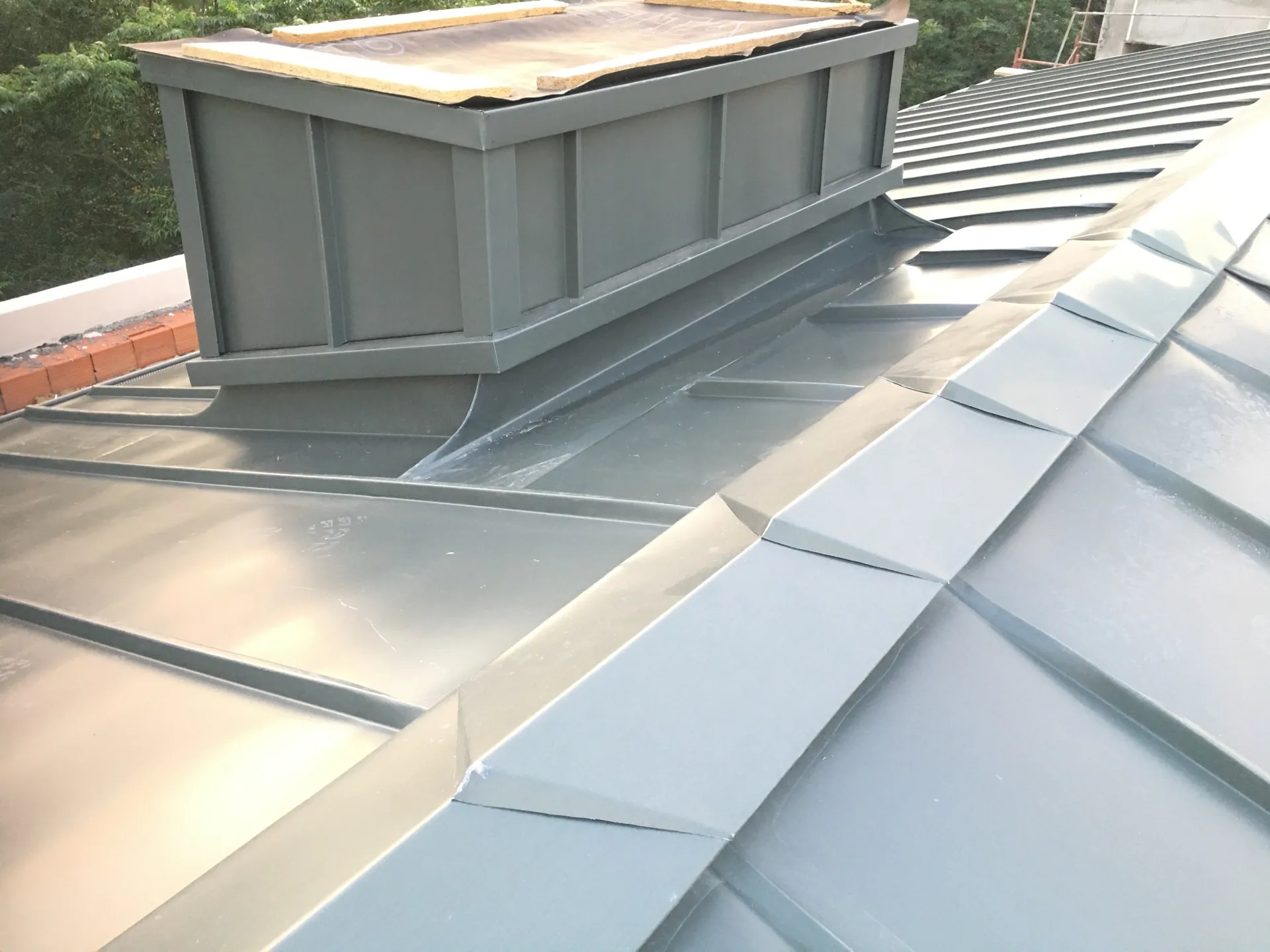 Standing seam roof chimney-abutment detail
