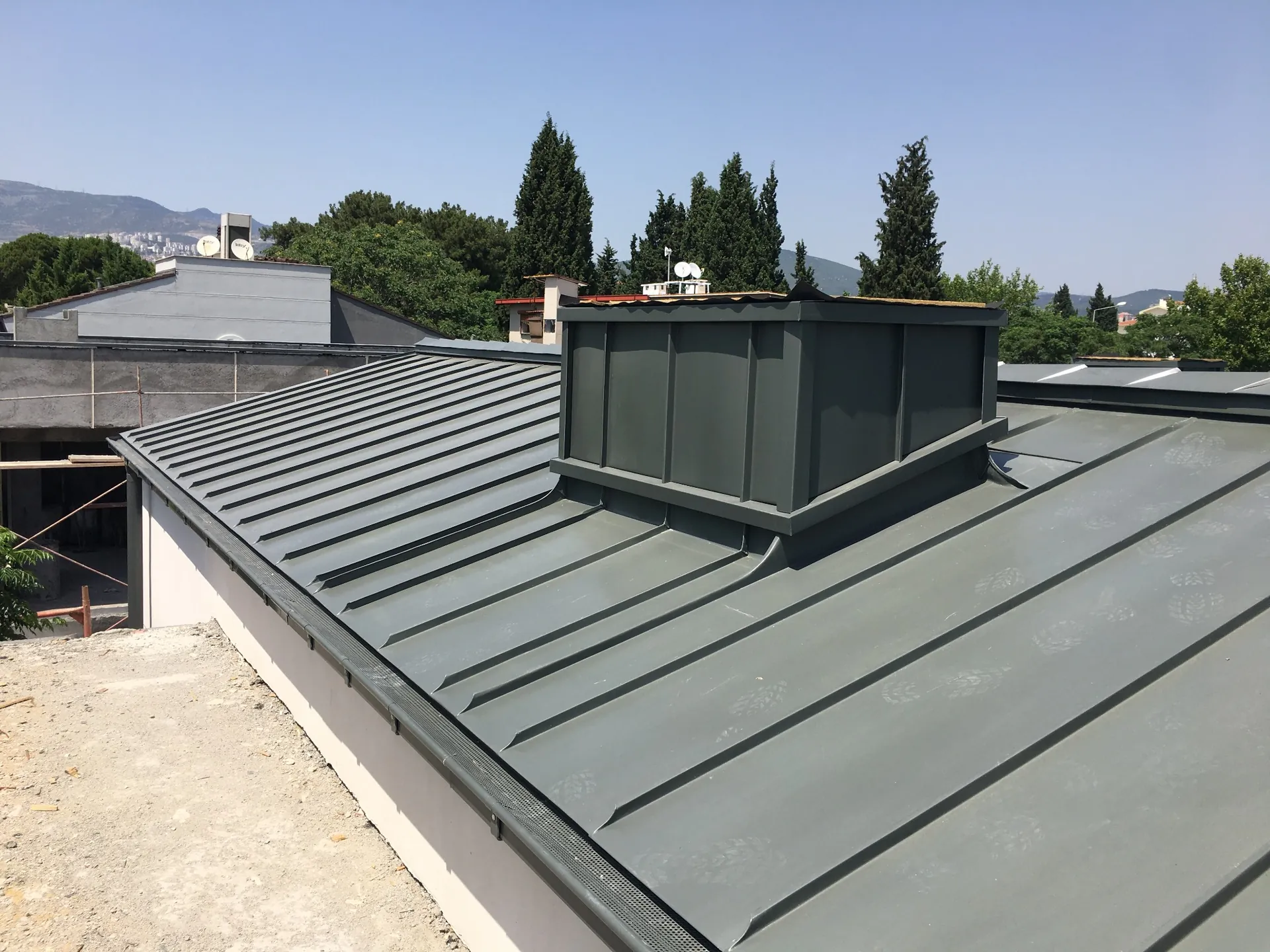 Standing seam roof vent and perimeter detail